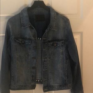 Jean jacket with purposeful distress.